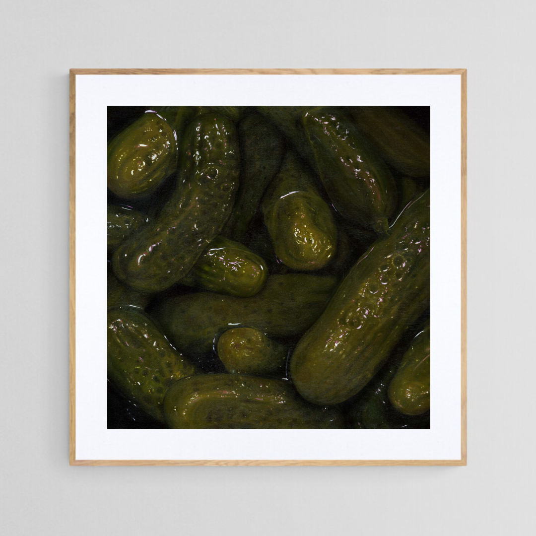 The original painting “Pickles" by Hannah Kilby from Hannah Michelle Studios, displayed as a 12x12" fine art print in a 16x16" oak frame.