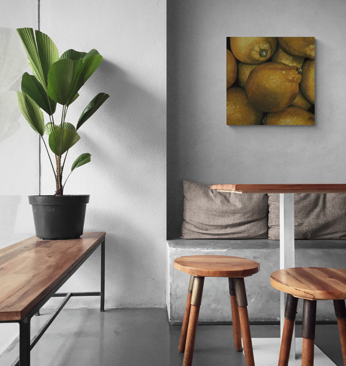 The original painting "Lemons" by Hannah Kilby from Hannah Michelle Studios, displayed on a wall.