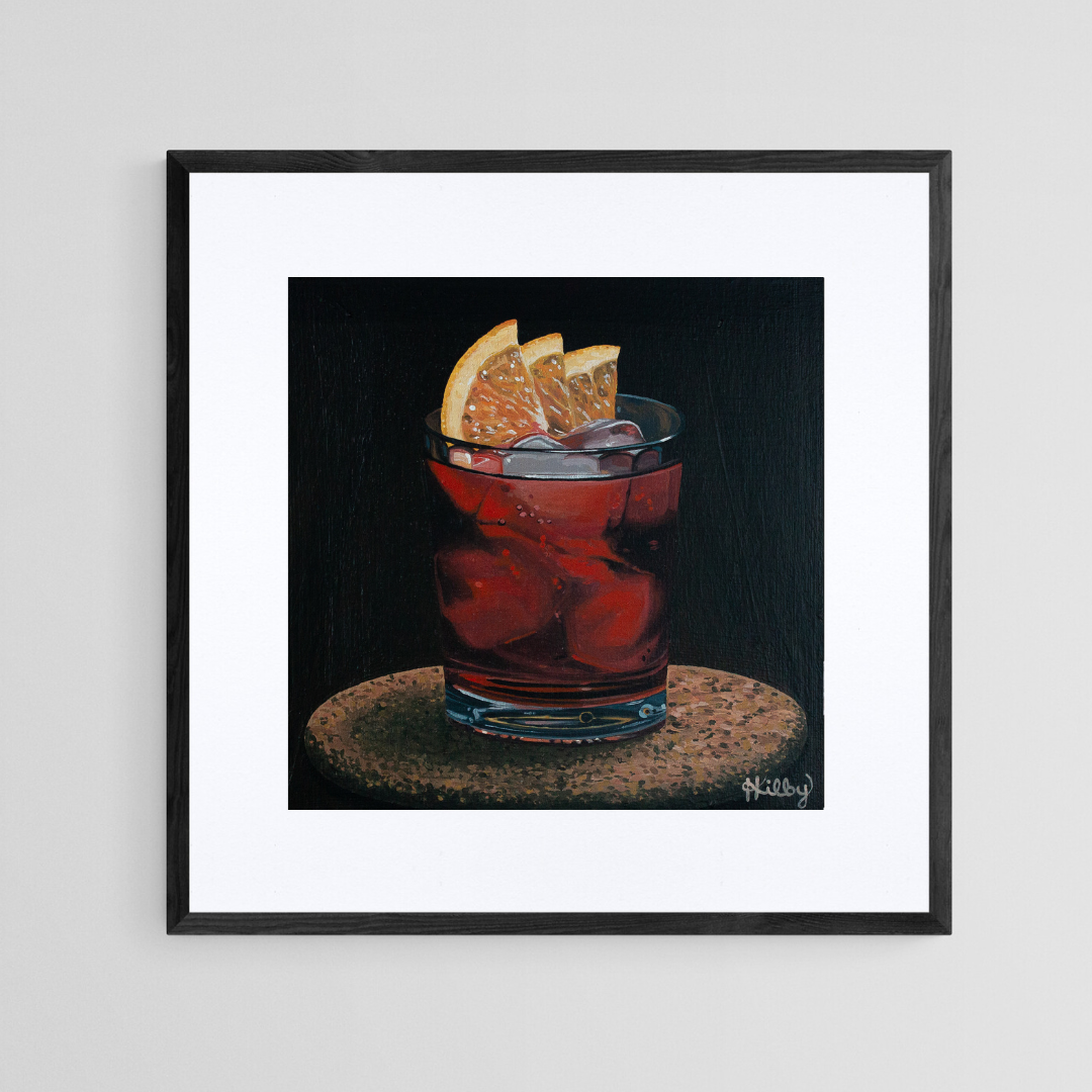 The original acrylic painting "Negroni" by Hannah Kilby from Hannah Michelle Studios, displayed as an 8x8" fine art print in a 12x12" sleek, black frame.