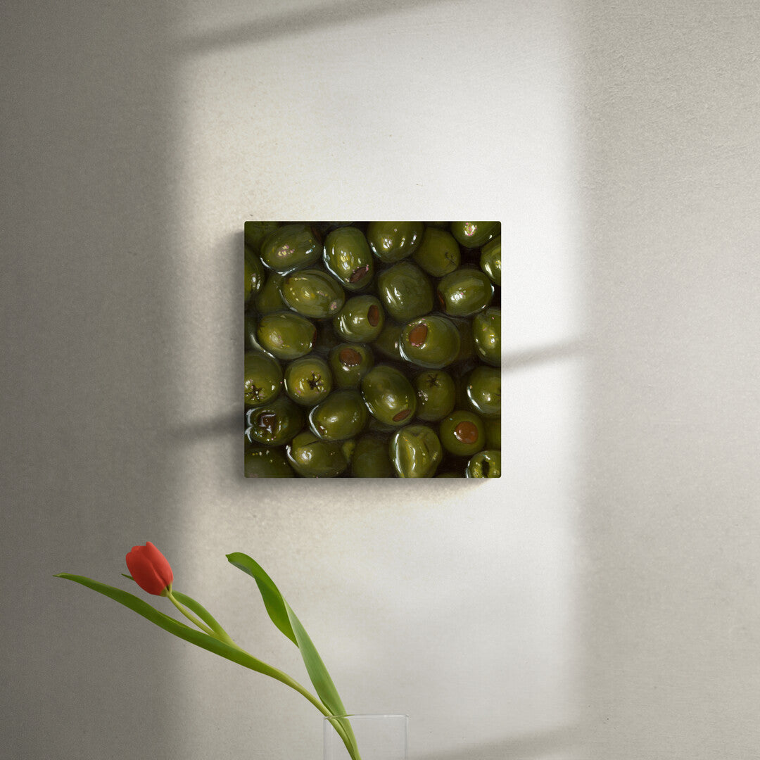 The original painting "Green Olives" by Hannah Kilby from Hannah Michelle Studios, displayed on a wall.