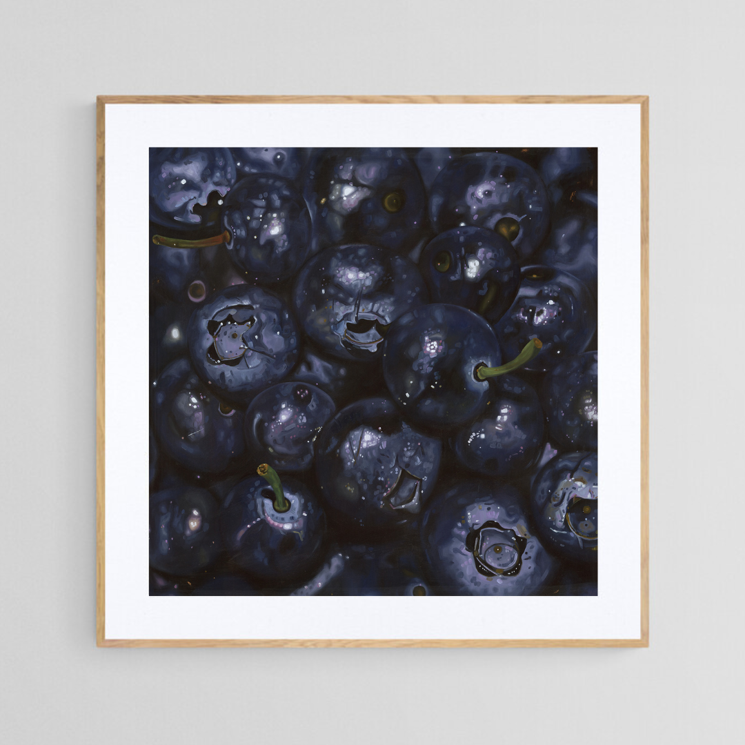 The original painting “Blueberries" by Hannah Kilby from Hannah Michelle Studios, displayed as a 12x12" fine art print in a 16x16" oak frame.