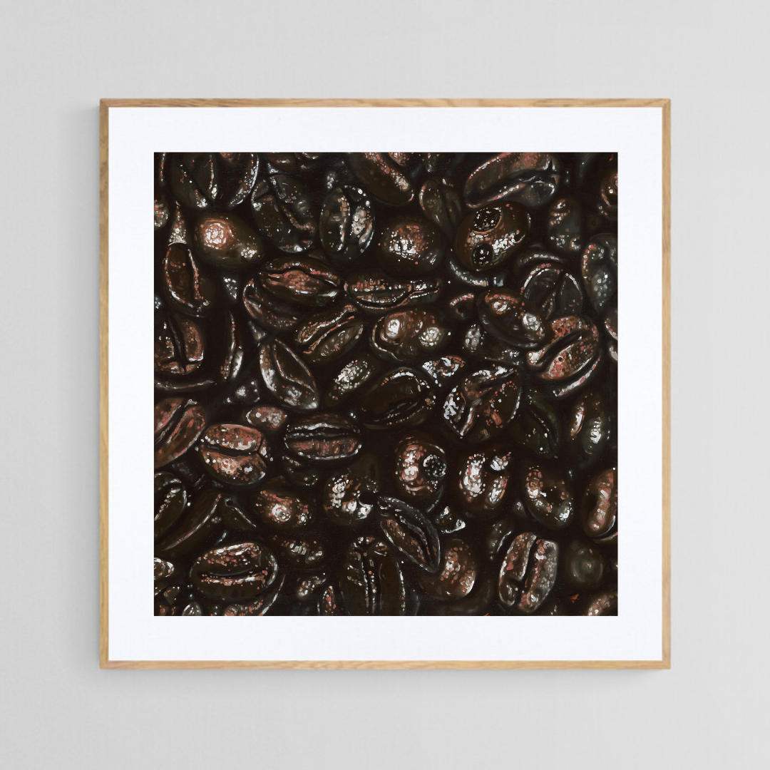 The original painting “Coffee Beans" by Hannah Kilby from Hannah Michelle Studios, displayed as a 12x12" fine art print in a 16x16" oak frame.
