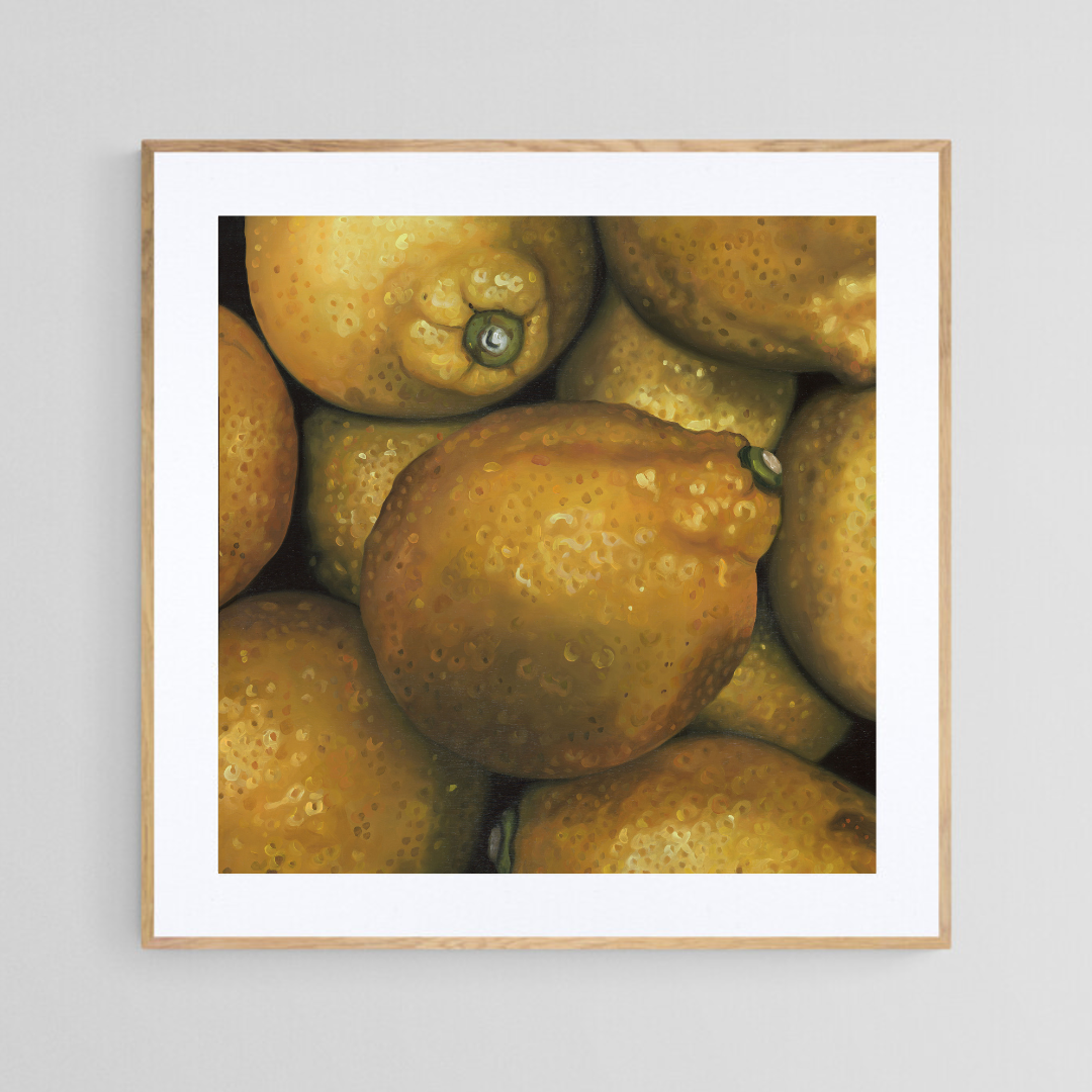 The original painting “Lemons" by Hannah Kilby from Hannah Michelle Studios, displayed as a 12x12" fine art print in a 16x16" oak frame.