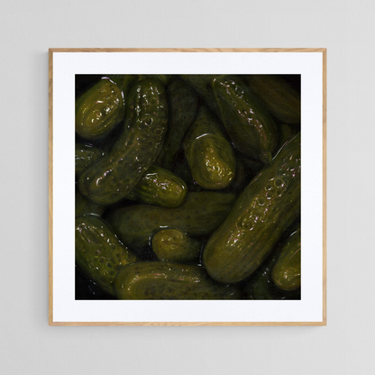 The original painting “Pickles" by Hannah Kilby from Hannah Michelle Studios, displayed as a 12x12" fine art print in a 16x16" oak frame.