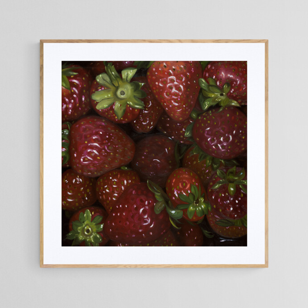 The original painting “Strawberries" by Hannah Kilby from Hannah Michelle Studios, displayed as a 12x12" fine art print in a 16x16" oak frame.