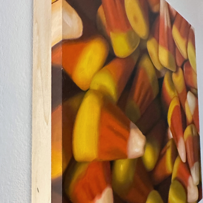 A close-up, edge view of the original painting "Candy Corn" by Hannah Kilby from Hannah Michelle Studios.