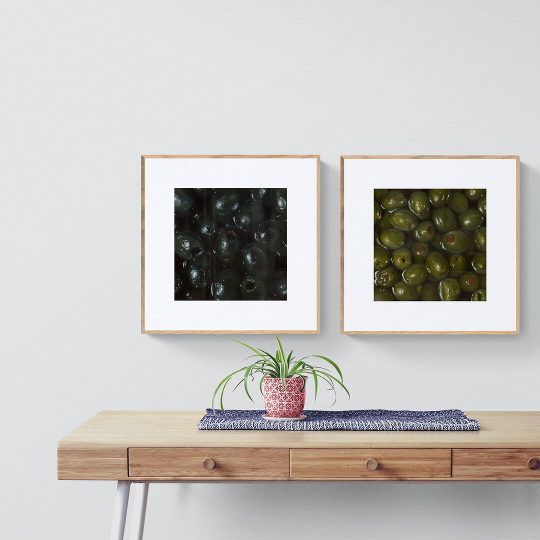 The original paintings “Green Olives” and “Black Olives” by Hannah Kilby from Hannah Michelle Studios, displayed as fine art prints.